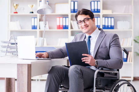 Disabled businessman working in the officeの写真素材