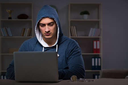 Hacker hacking the data late at night