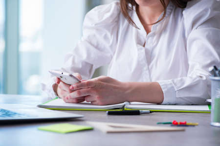 Woman hands working on computer at deskの写真素材