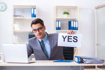 Businessman in positive yes answer in the officeの写真素材