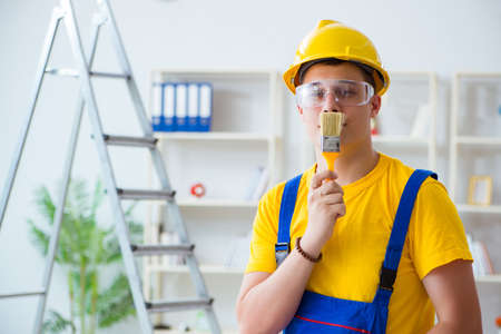 Painter working at home in refurbishment project