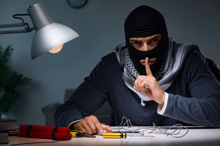 Terrorist bomber preparing dynamite bombの写真素材