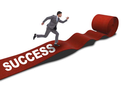 Businessman on red carpet isolated white backgroundの写真素材