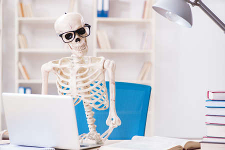 Skeleton businessman working in the office