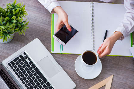 Top view of working desk with hands