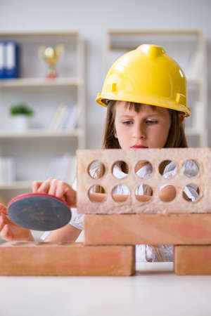 Young girl building with construction bricksの写真素材