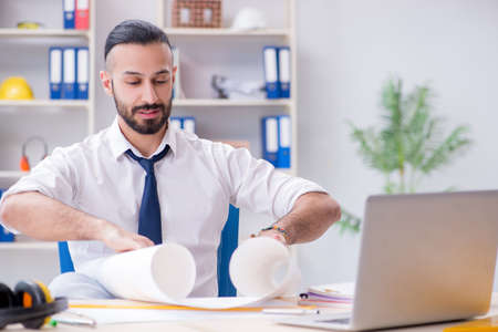 Architect working in his studio on new projectの写真素材