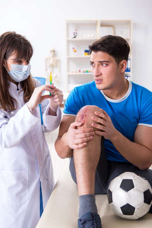 Football soccer player visiting doctor after injuryの写真素材