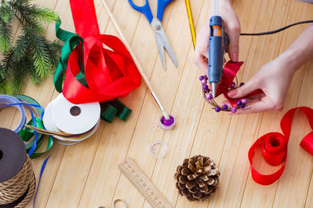 Woman doiing DIY festive decorations at home