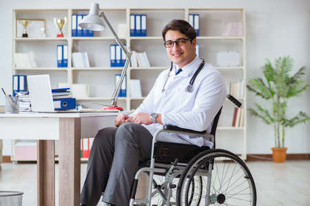 Disabled doctor on wheelchair working in hospitalの写真素材