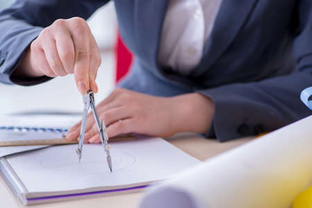 Woman architect working on the project   
