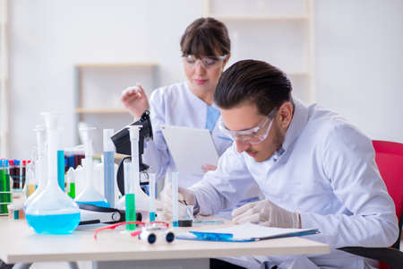 Team of chemists working in the lab