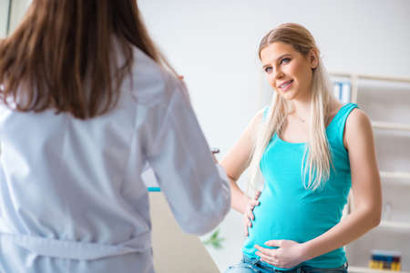 Pregnant woman at regular pregnancy check-upの写真素材