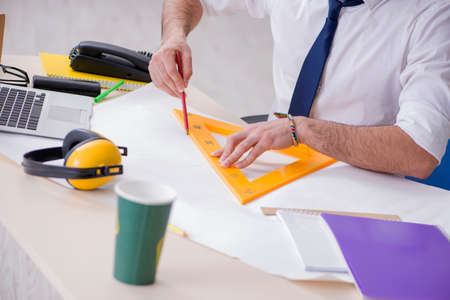 Architect working in his studio on new project