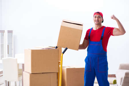 Contractor worker moving boxes during office moveの写真素材