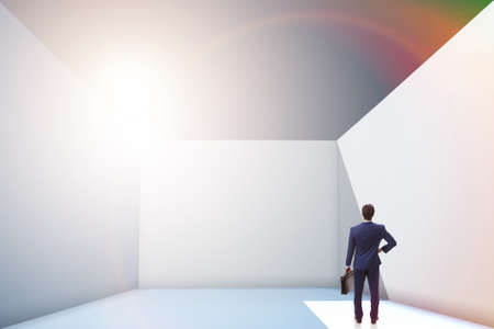 Businessman trying to escape from difficult situationの写真素材