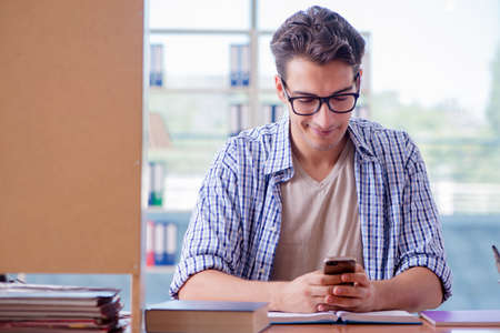 Student studying at home preparing for examの写真素材