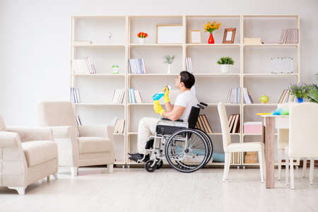 Disabled cleaner doing chores at homeの写真素材