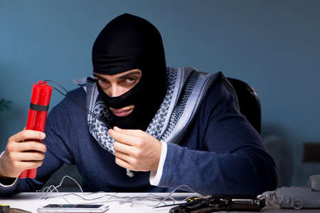 Terrorist bomber preparing dynamite bombの写真素材