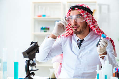 Arab chemist working in the lab officeの写真素材