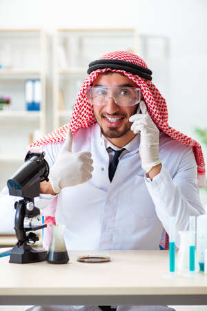 Arab chemist working in the lab officeの写真素材
