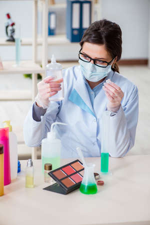 Lab chemist checking beauty and make-up productsの写真素材