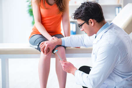 Doctor neurologist examining female patientの写真素材