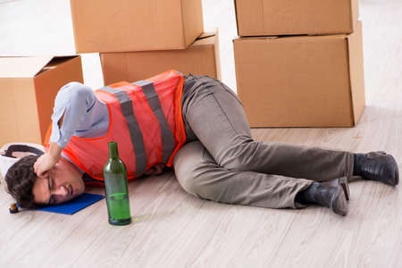 Delivery man drunk at workの写真素材