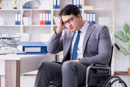 Disabled businessman working in the officeの写真素材