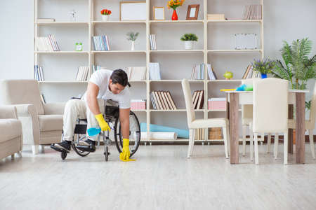 Disabled cleaner doing chores at homeの写真素材