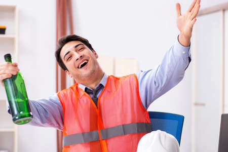 Drunk engineer working in the workshop
