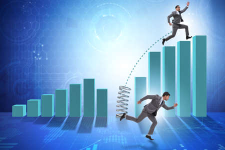 Business people jumping over bar charts