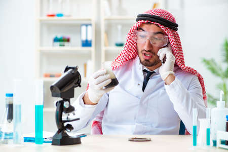 Arab chemist scientist testing quality of oil petrolの写真素材