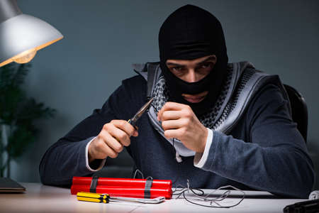 Terrorist bomber preparing dynamite bomb