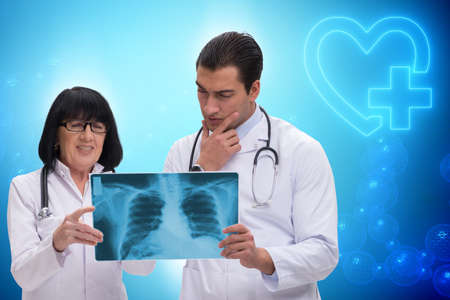 Two doctors discussing x-ray image in telemedicine concept