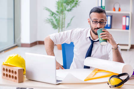 Architect working in his studio on new projectの写真素材
