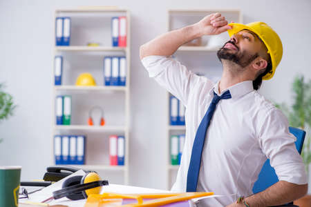 Architect working in his studio on new projectの写真素材