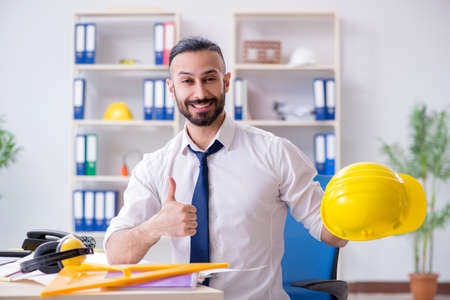 Architect working in his studio on new projectの写真素材