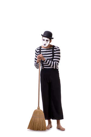Mime with broom isolated on white backgroundの写真素材