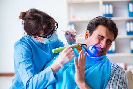Patient afraid of dentist during doctor visitの写真素材