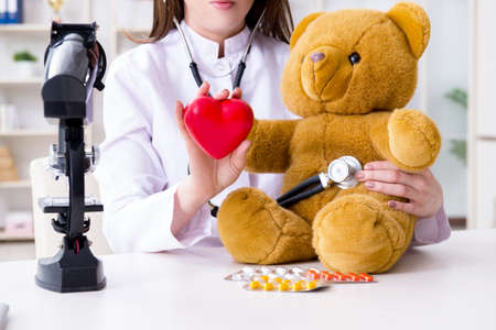 Child checking soft toy health