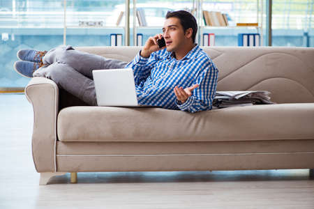Caucasian student with laptop preparing for university examsの写真素材