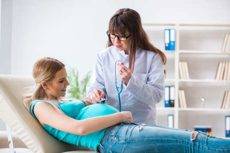 Pregnant woman at regular pregnancy check-upの写真素材