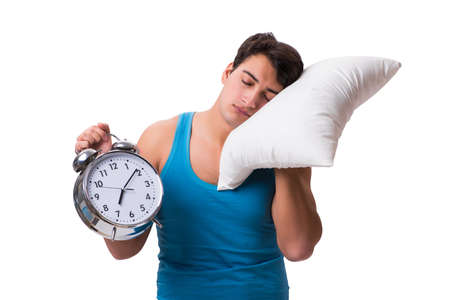 Young man with pillow isolated on white backgroundの写真素材