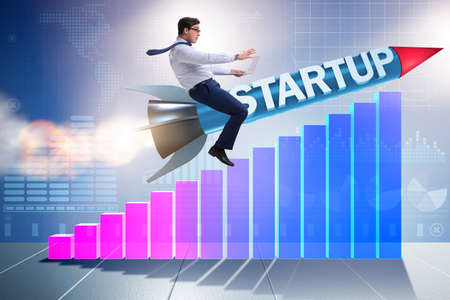 Businessman in start-up concept flying on rocketの写真素材