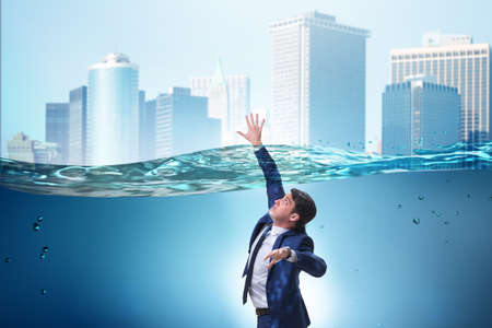 Drowning businessman in insolvency and bankruptcy conceptの写真素材