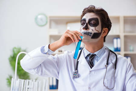 Scary monster doctor working in labの写真素材