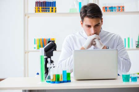 Male chemist working in labの写真素材