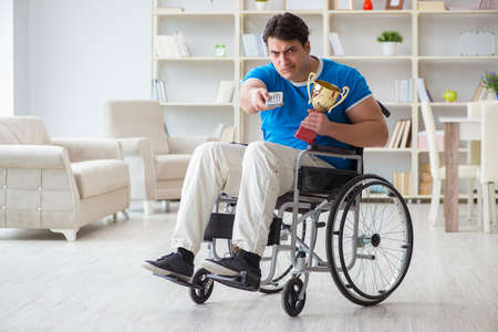 Disabled man watching sports on tv