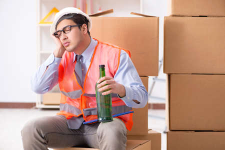 Delivery man drunk at workの写真素材